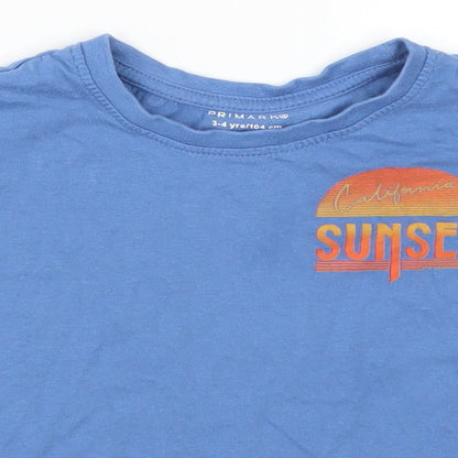 Close-up detail of Primark boys’ blue basic t-shirt, size 3-4, years - california sunset