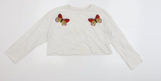Front view of Messy Bun women’s white cropped t-shirt, size L, - butterfly