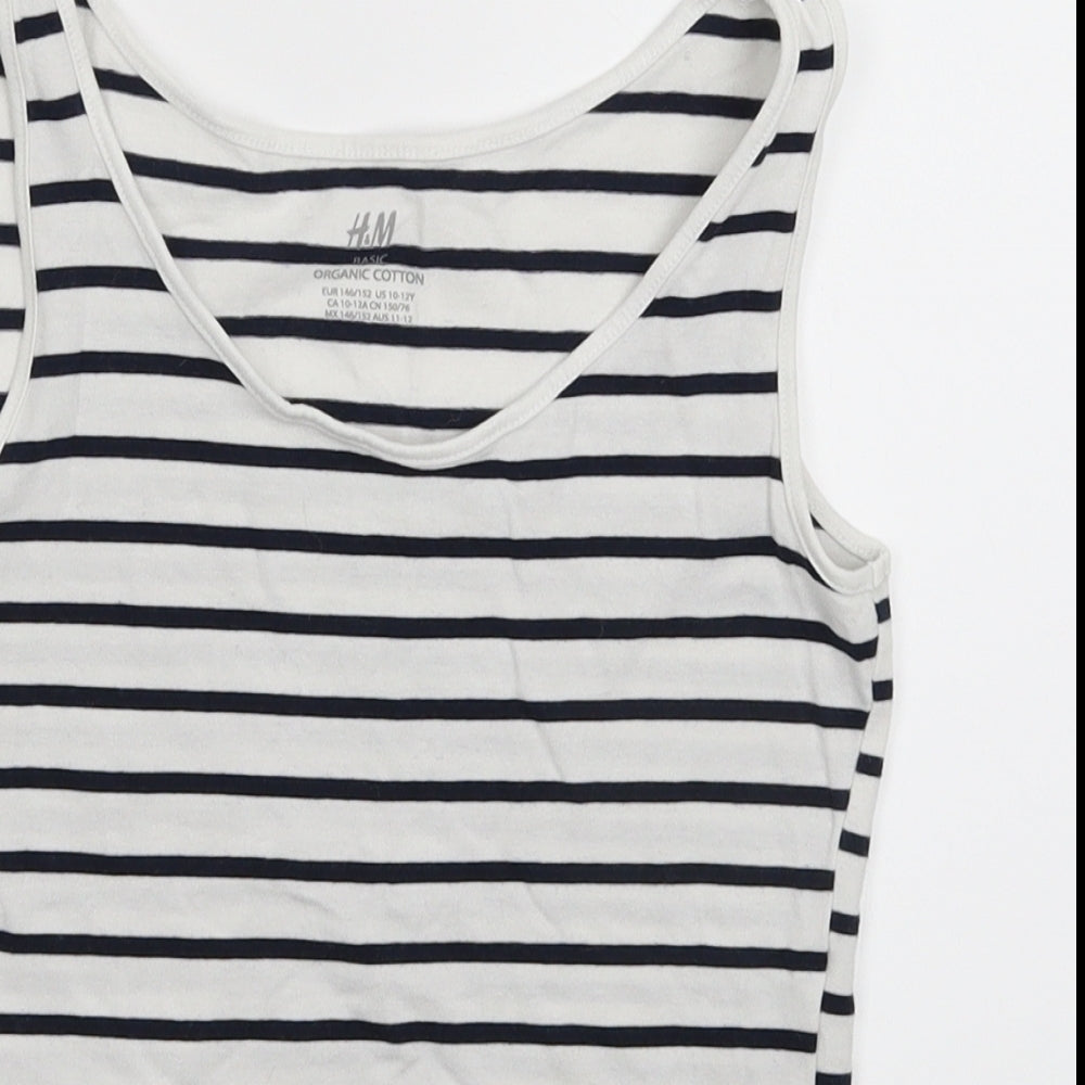 Close-up detail of H&M girls’ white striped basic tank, size 11-12, years
