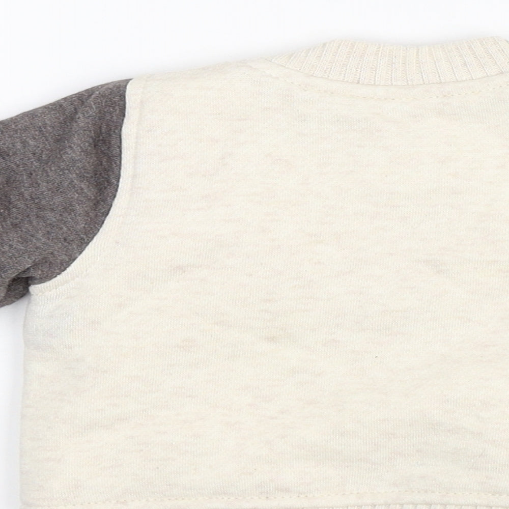 Brand and care label for Nutmeg Beige Jacket, size 0-3, Months