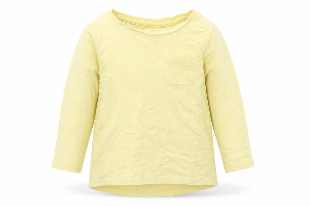 Front view of Nutmeg girls’ yellow basic t-shirt, size 12-18, months