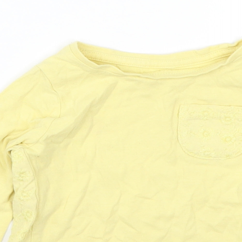 Close-up detail of Nutmeg girls’ yellow basic t-shirt, size 12-18, months