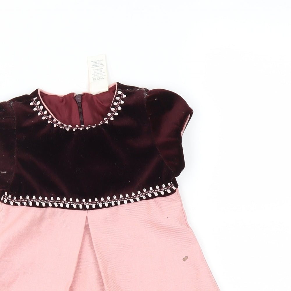 Close-up detail of Preworn boys’ pink shift, size 12, months