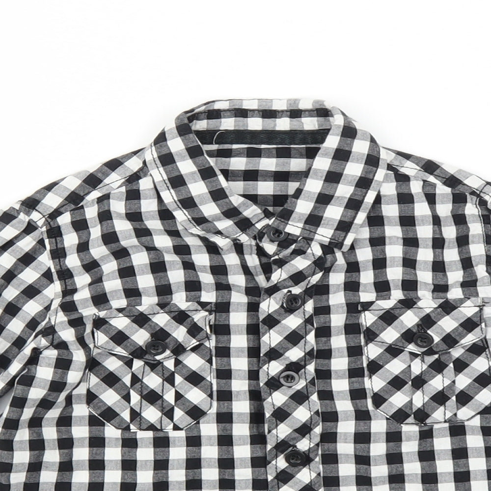 Close-up detail of St Bernard boys’ black check basic button-up, size 4, years