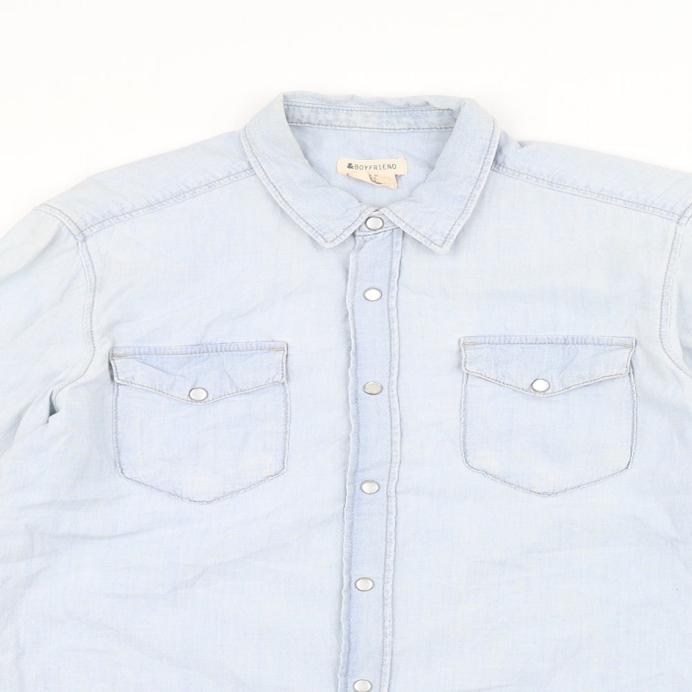 Close-up detail of boyfriend women’s blue denim jacket, size UK 8