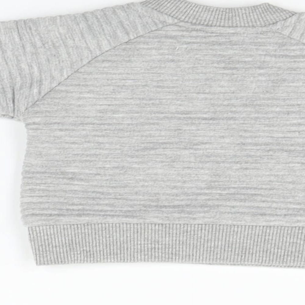 Brand and care label for Early Days girls’ grey jumper, size 0-3, months