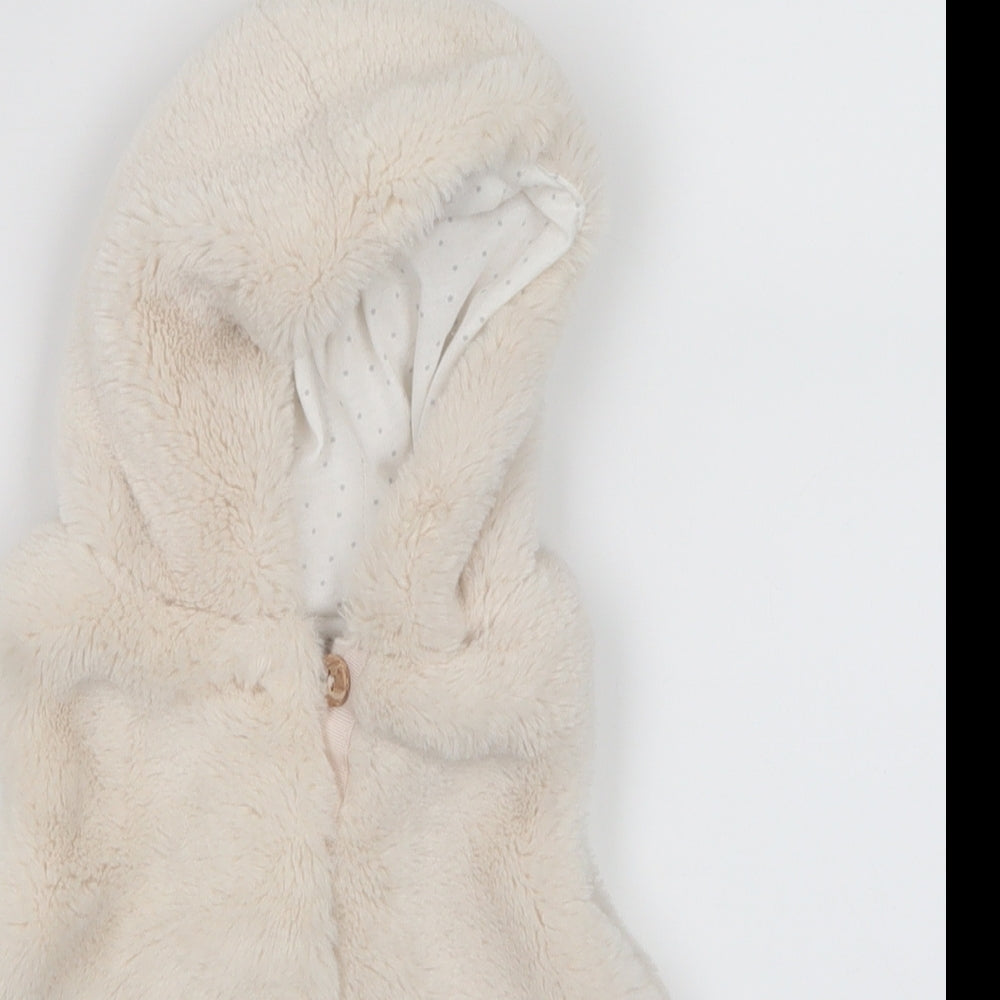 Close-up detail of Primark girls’ white jacket, size 0-3, months