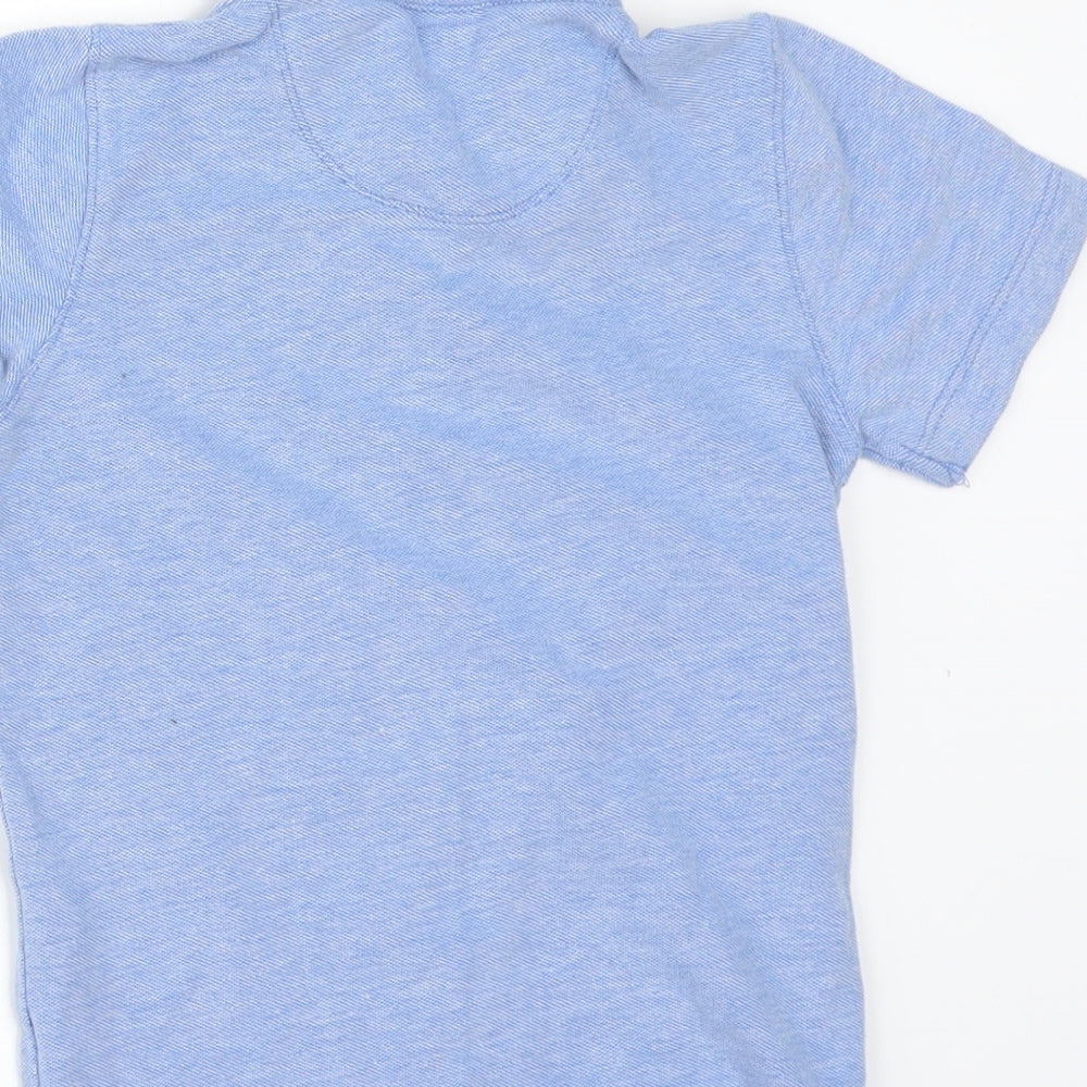 Brand and care label for Next boys’ blue basic polo, size 3, years