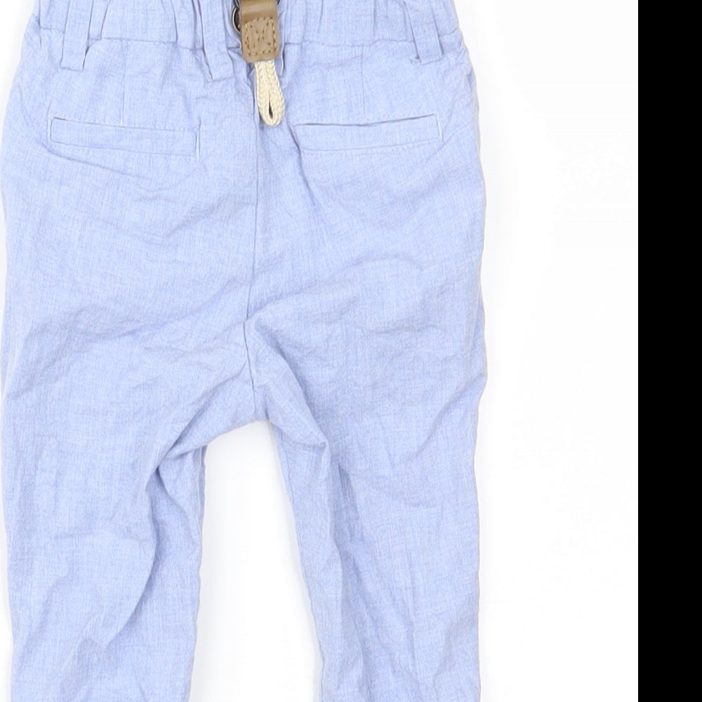 Brand and care label for Next boys’ blue cargo trousers, size 9, months