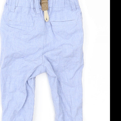 Brand and care label for Next boys’ blue cargo trousers, size 9, months