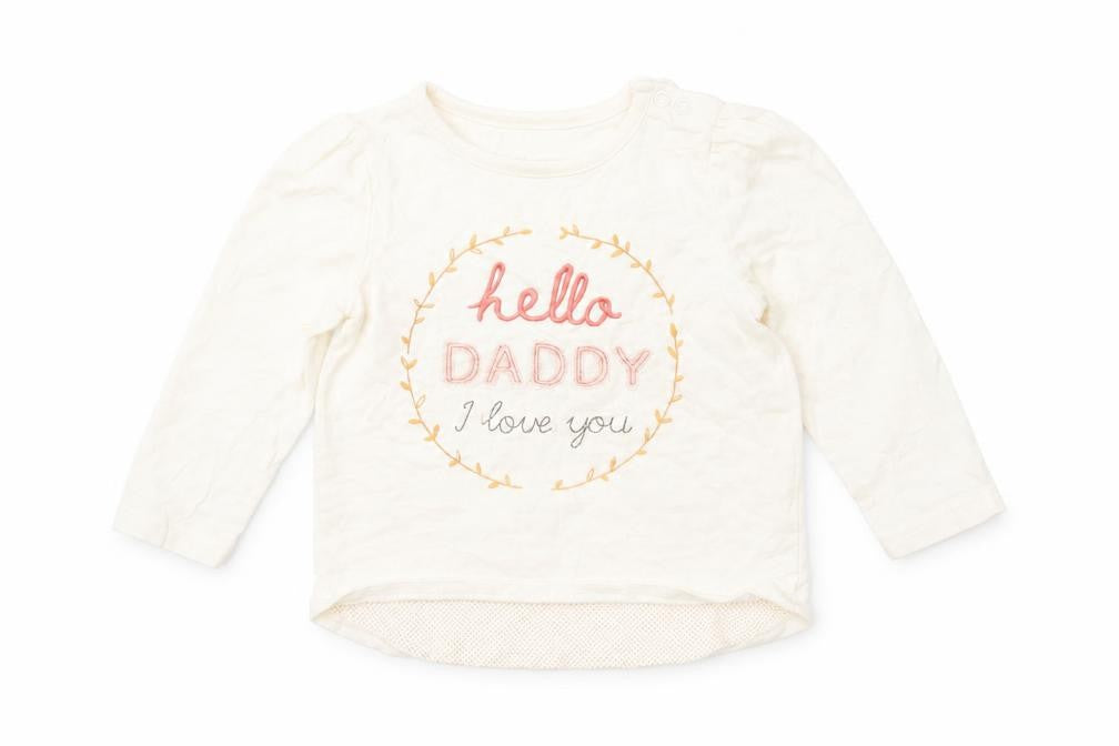 Front view of Nutmeg girls’ ivory basic t-shirt, size 9-12, months