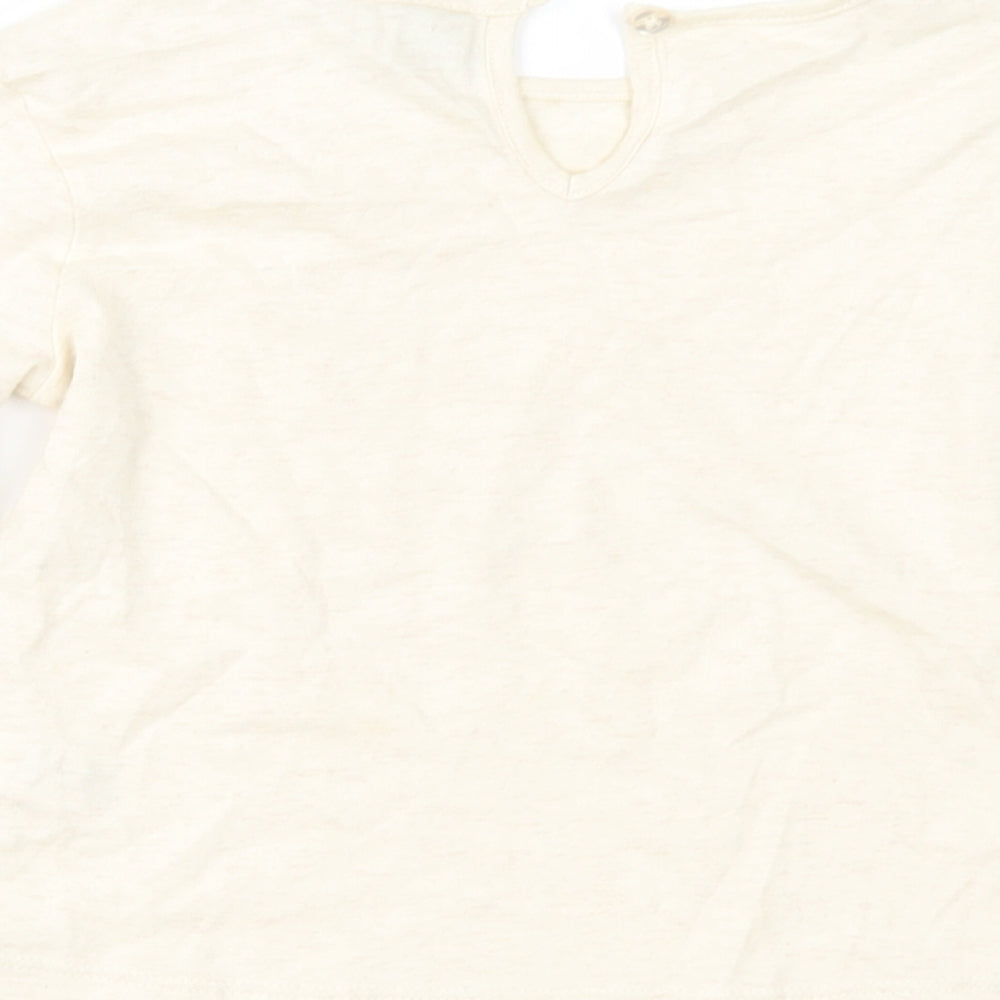 Brand and care label for Tu girls’ beige basic t-shirt, size 2-3, years