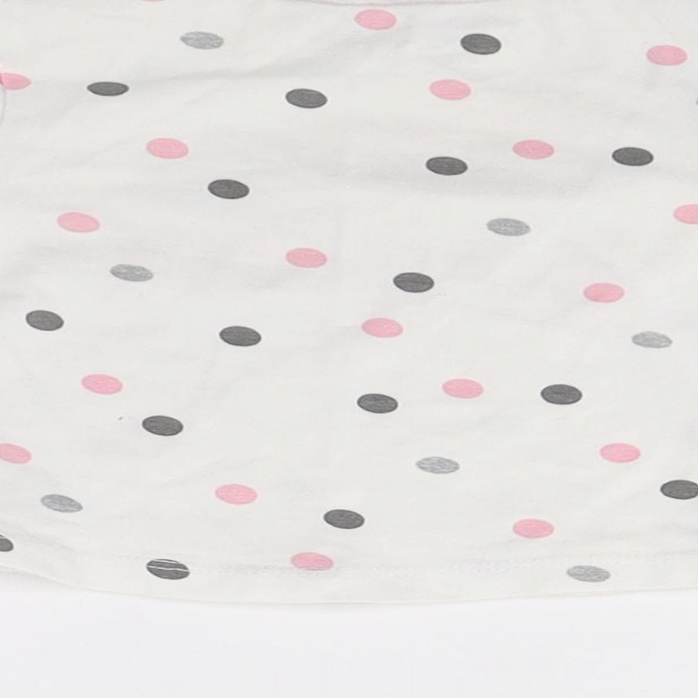 Brand and care label for Quapi girls’ white polka dot jumper, size 0-3, months - hello beautiful