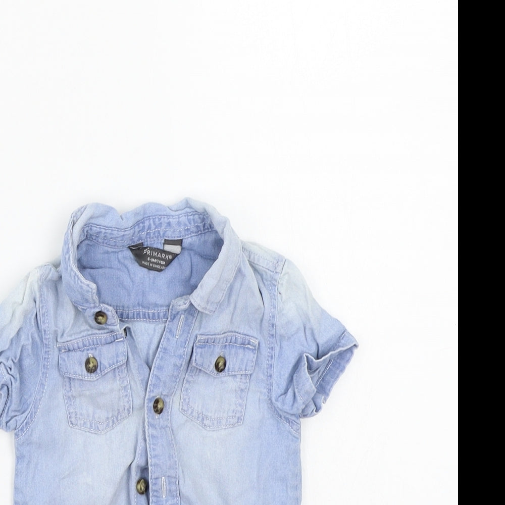Close-up detail of Primark girls’ blue basic button-up, size 6-9, months