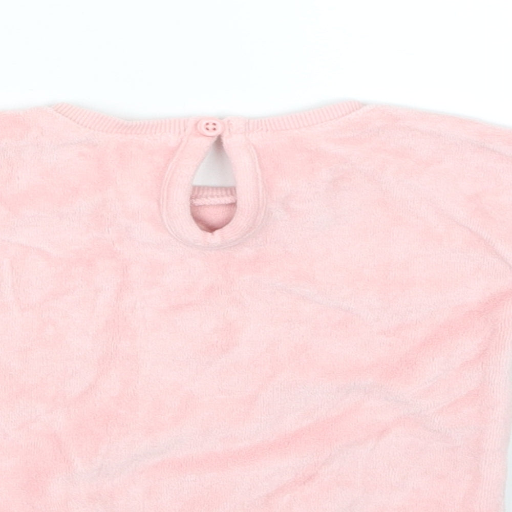 Brand and care label for George girls’ pink jumper, size 0-3, months