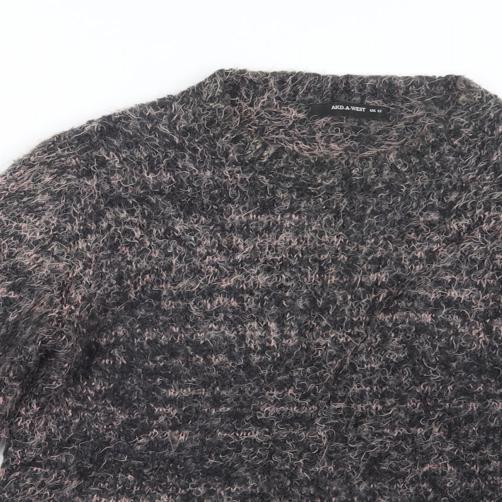 Close-up detail of AKD A WEST women’s pink knit jumper, size UK 12