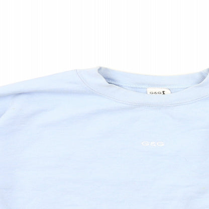 Close-up detail of g&g women’s blue pullover sweatshirt, size M, - cropped