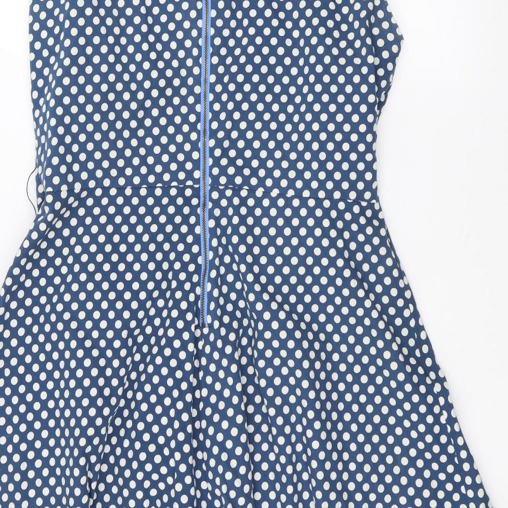 Brand and care label for Vacknox women’s blue polka dot a-line, size UK 12