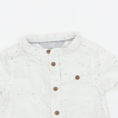 Close-up detail of Primark boys’ white basic button-up, size 3-6, months