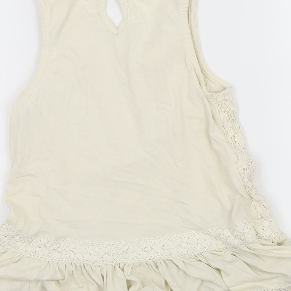 Brand and care label for Next girls’ ivory jersey basic tank, size 8, years