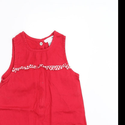 Close-up detail of H&M girls’ red shift, size 18-24, months
