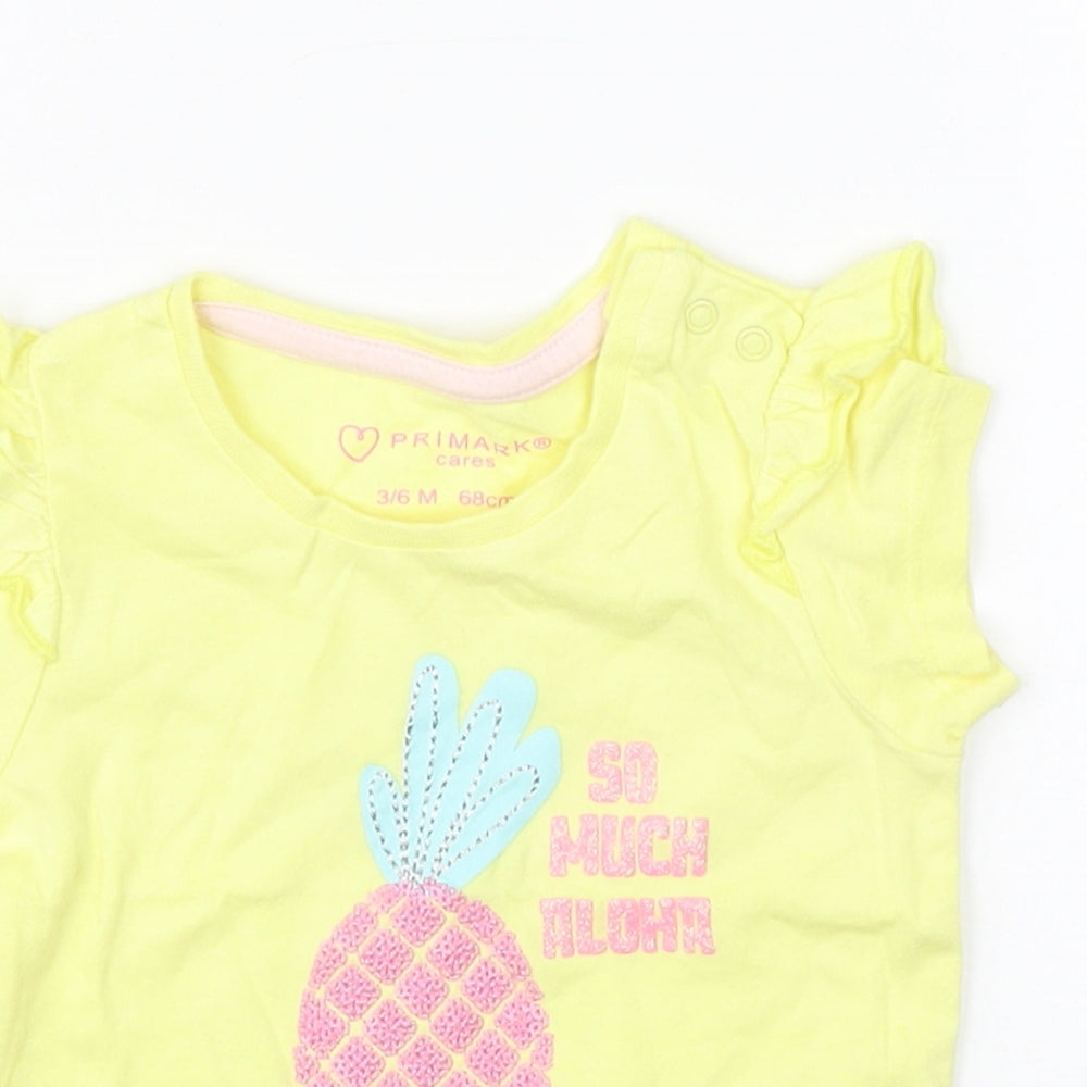 Close-up detail of Primark girls’ yellow basic t-shirt, size 3-6, months