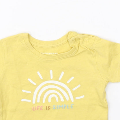 Close-up detail of Primark girls’ yellow basic t-shirt, size 6-9, months