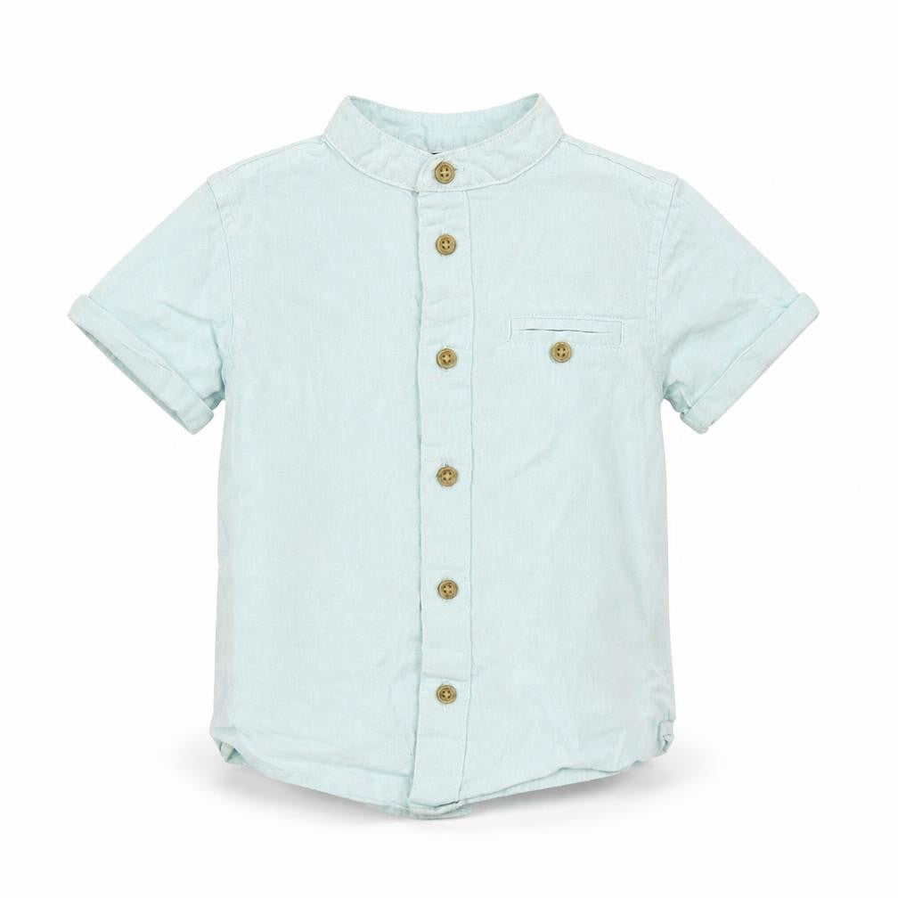Front view of Primark girls’ blue basic button-up, size 18-24, months