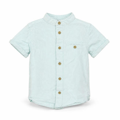 Front view of Primark girls’ blue basic button-up, size 18-24, months