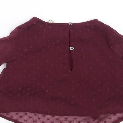 Brand and care label for River Island girls’ purple basic blouse, size 3-6, months