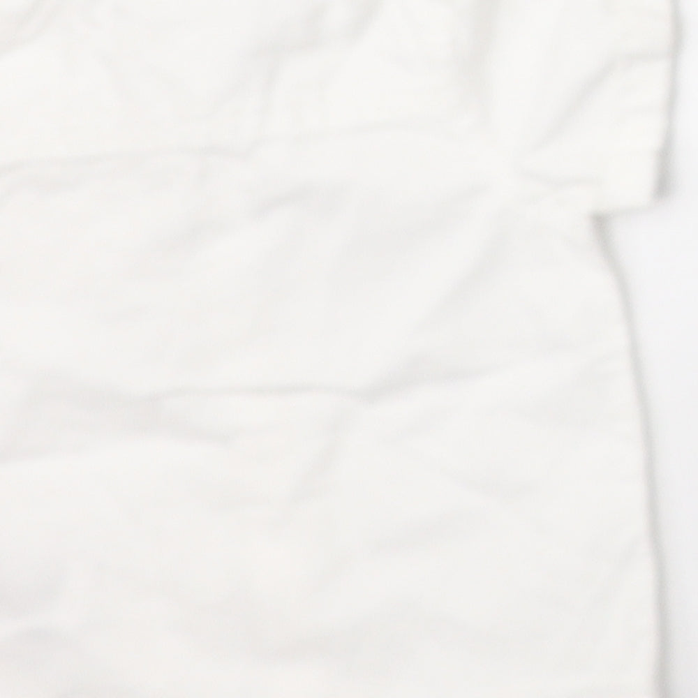 Brand and care label for F&F boys’ white basic button-up, size 0-3, months