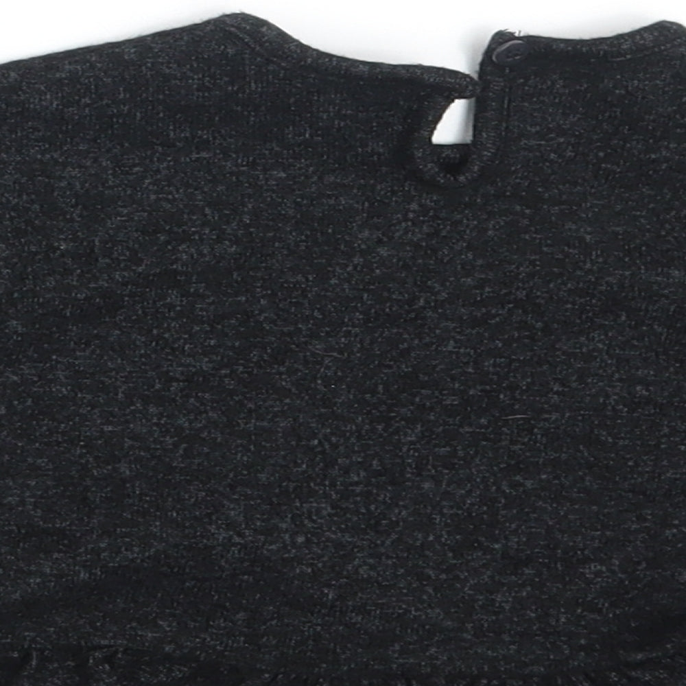 Brand and care label for George girls’ grey jumper, size 3-6, months