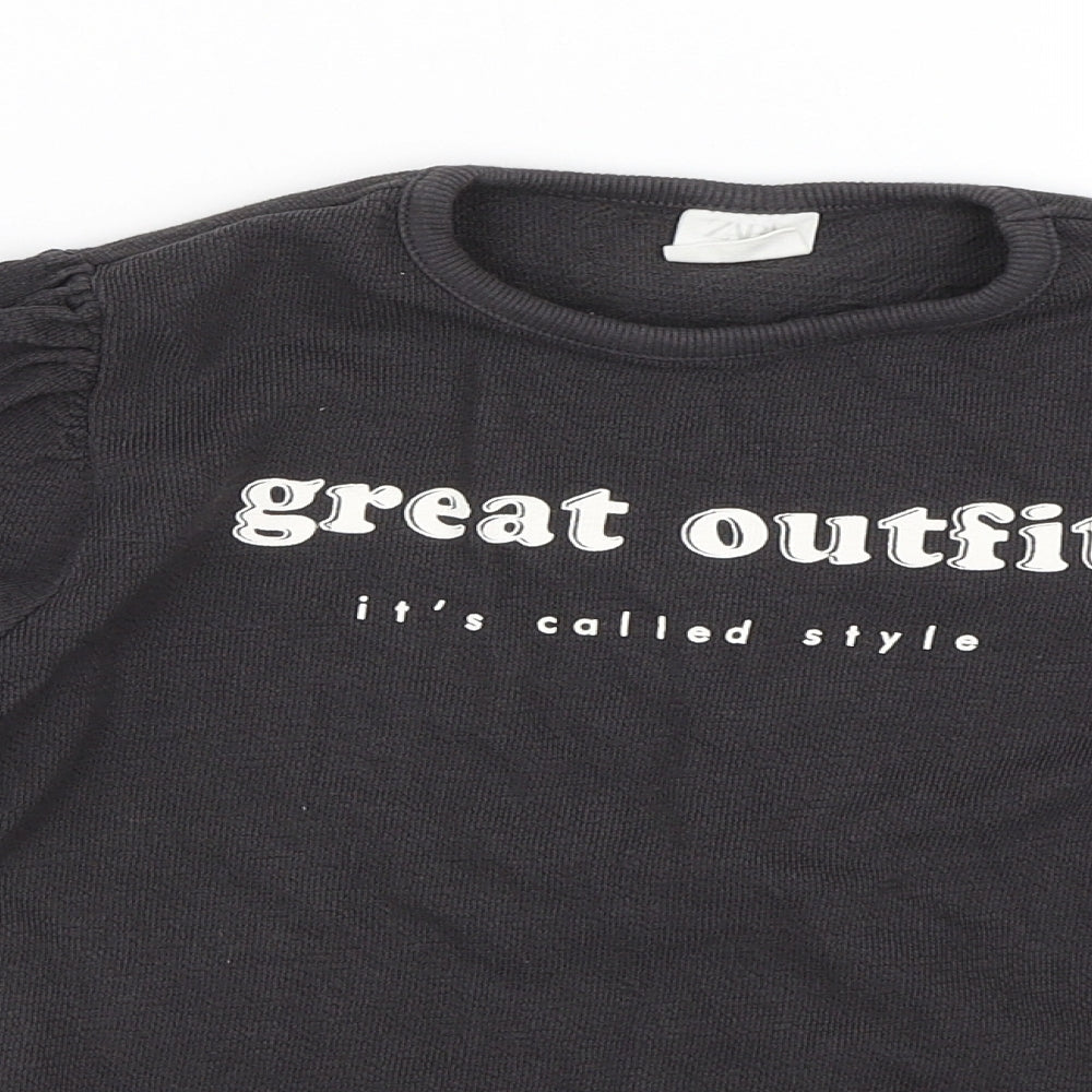Close-up detail of Zara girls’ black basic t-shirt, size 8, years
