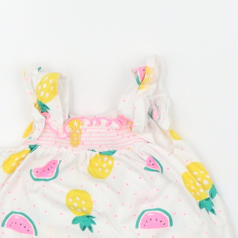 Close-up detail of Preworn girls’ white basic blouse, size 3-6, months - pineapple