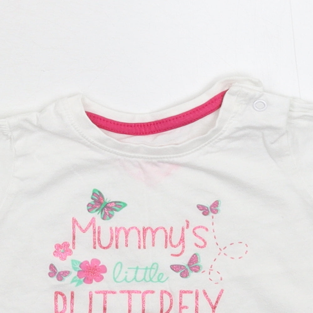 Close-up detail of Primark girls’ white basic t-shirt, size 6-9, months