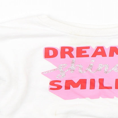 Close-up detail of Primark girls’ white jumper, size 12-18, months
