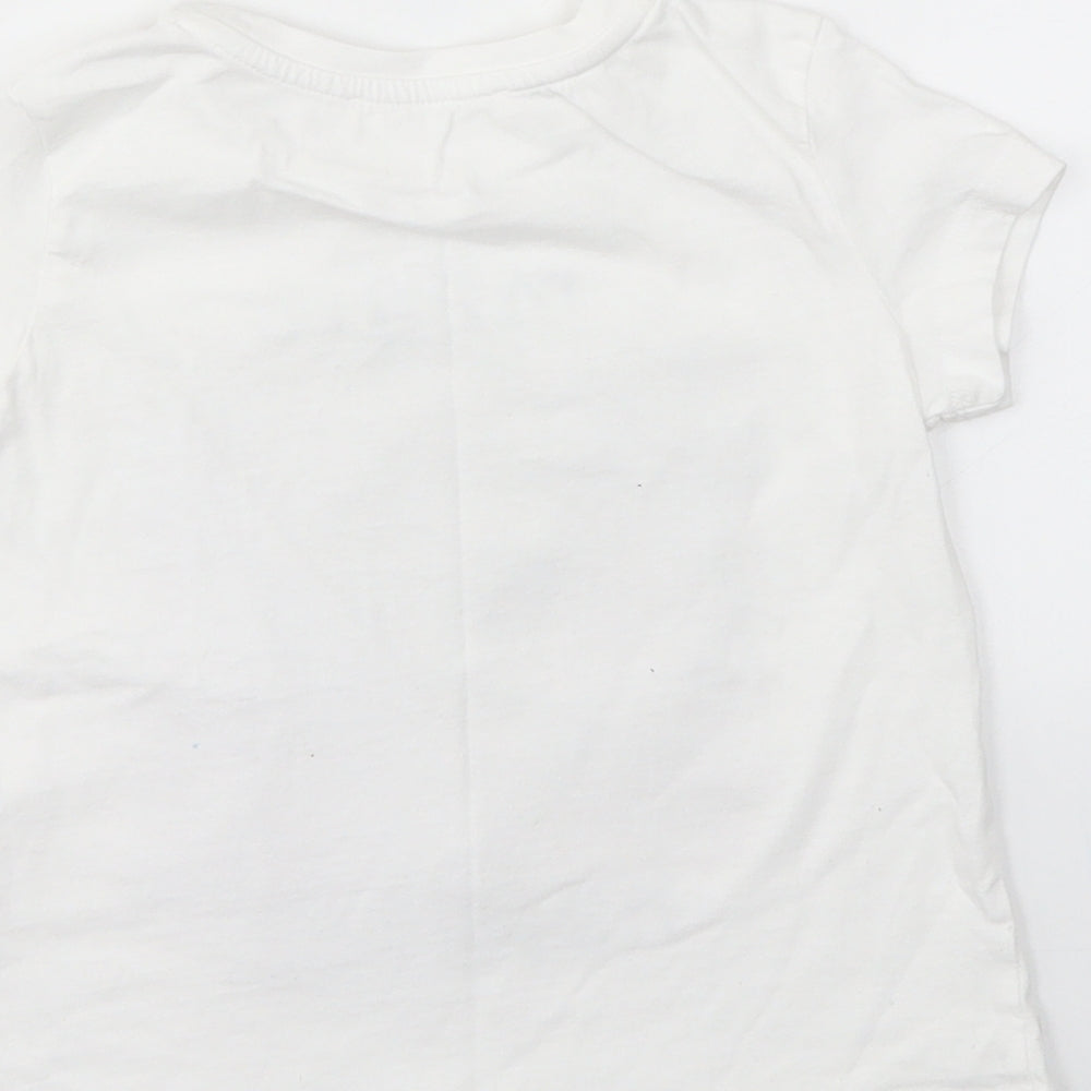 Brand and care label for KOTON girls’ white basic t-shirt, size 4-5, years