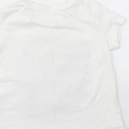 Brand and care label for KOTON girls’ white basic t-shirt, size 4-5, years