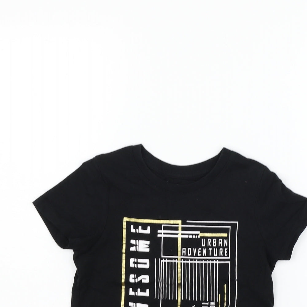 Close-up detail of Nutmeg girls’ black basic t-shirt, size 6-7, years