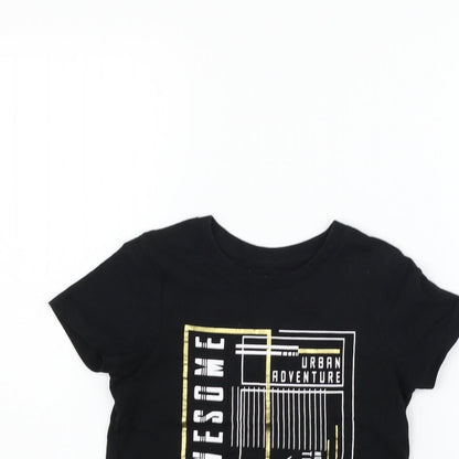 Close-up detail of Nutmeg girls’ black basic t-shirt, size 6-7, years