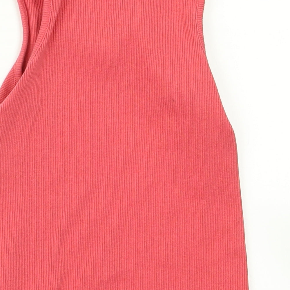 Brand and care label for Next girls’ pink rayon basic tank, size 4, years