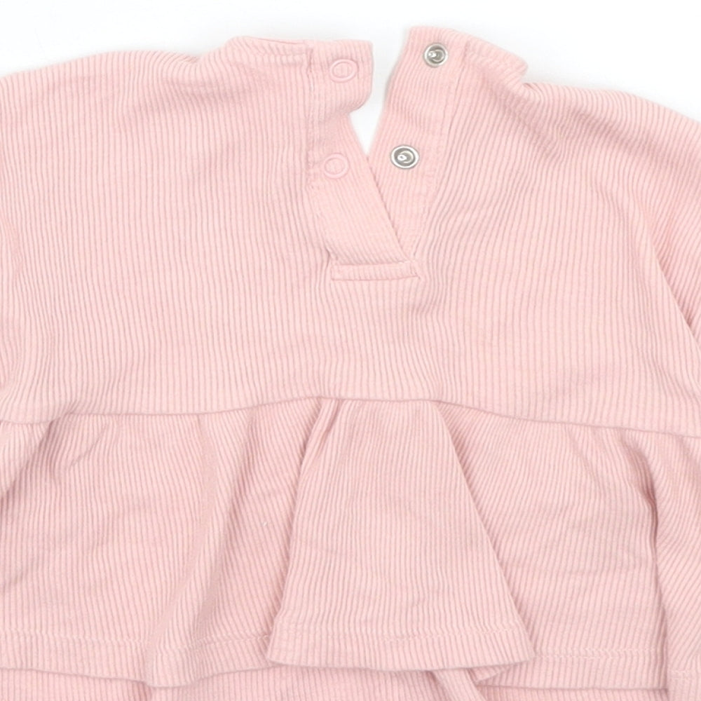 Brand and care label for George boys’ pink ringer blouse, size 0-3, months