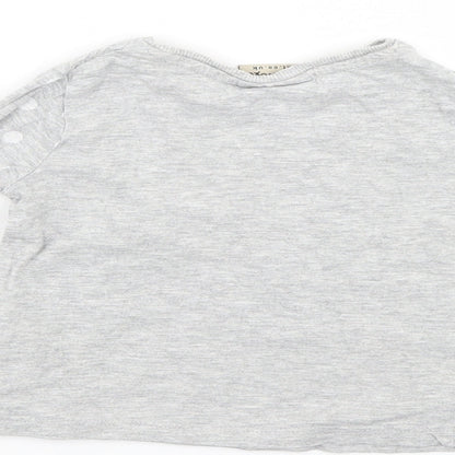 Brand and care label for Next girls’ grey jumper, size 9-12, months