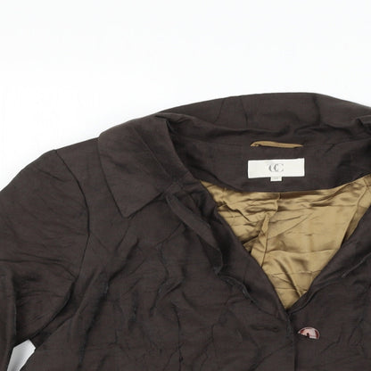 Close-up detail of county casual women’s brown jacket blazer, size UK 14, - broken button