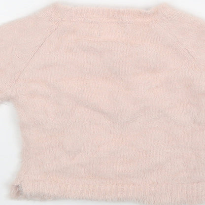 Brand and care label for Primark girls’ pink jumper, size 6-9, months