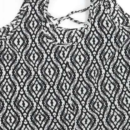 Brand and care label for YD girls’ black argyle/diamond basic blouse, size 11-12, years