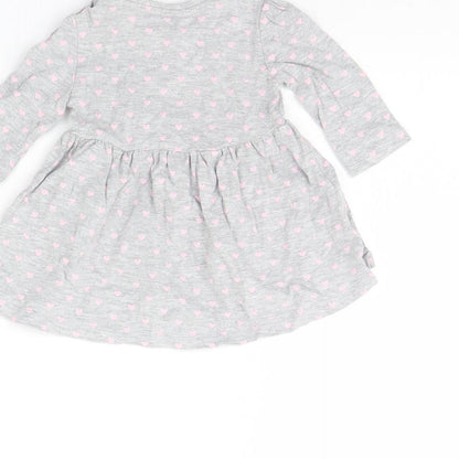 Brand and care label for Early Days girls’ grey spotted basic blouse, size 0-3, months