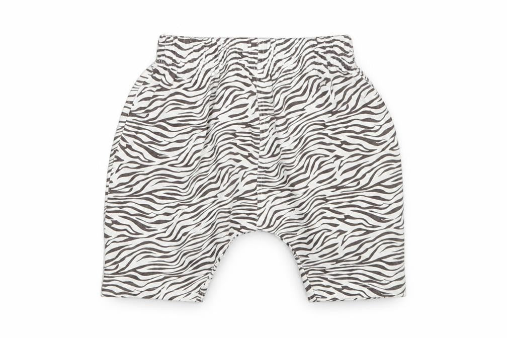 Front view of Matalan girls’ white animal print sweatpants, size 9-12, months