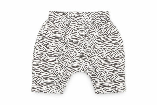 Front view of Matalan girls’ white animal print sweatpants, size 9-12, months