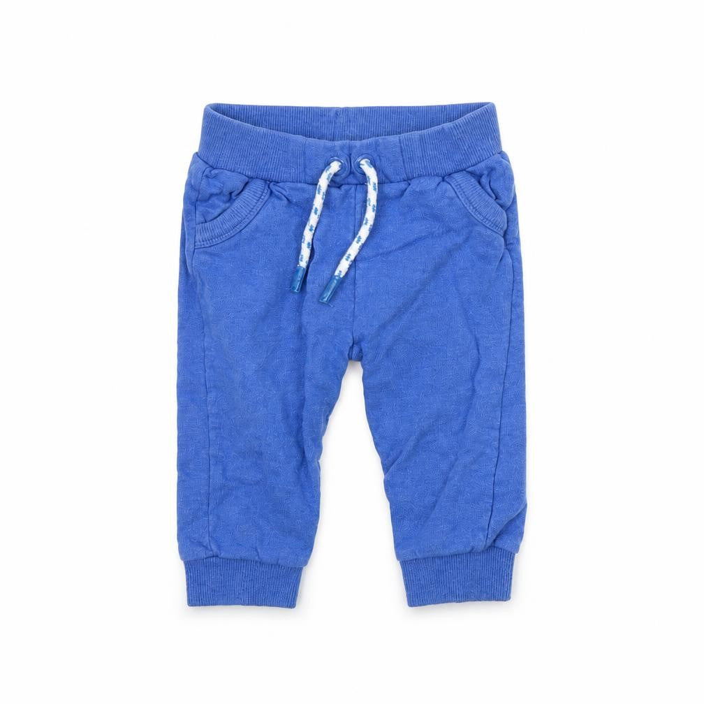 Front view of Mini Club boys’ blue jogger trousers, size 9, months